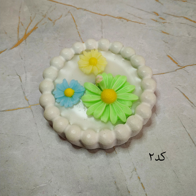 شمع مدل بابونه و سنگ مصنوعی تزئینی سبز