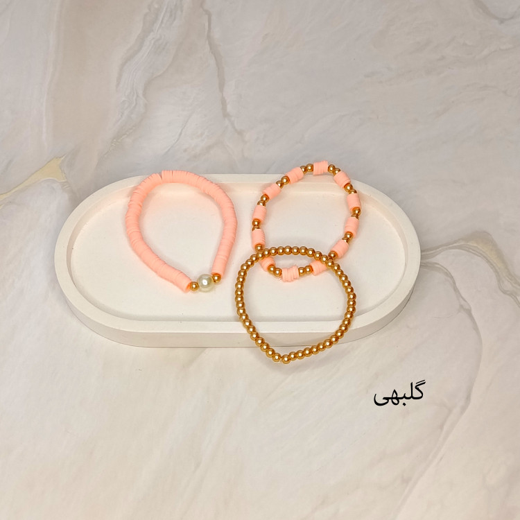 دستبند سه تایی فیمو واشری و مروارید گلبهی رنگ با مهره های طلایی