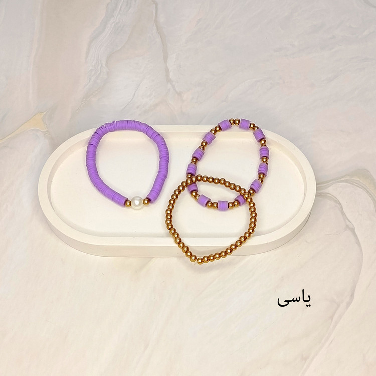 دستبند سه تایی فیمو واشری و مروارید یاسی رنگ با مهره های طلایی