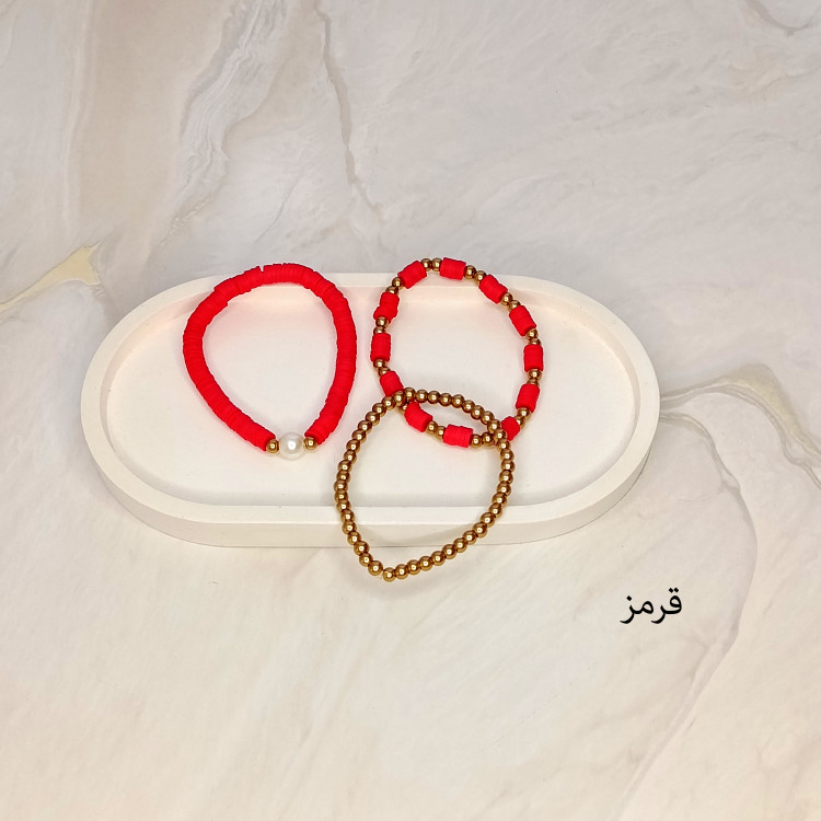 دستبند سه تایی فیمو واشری و مروارید قرمز رنگ با مهره های طلایی