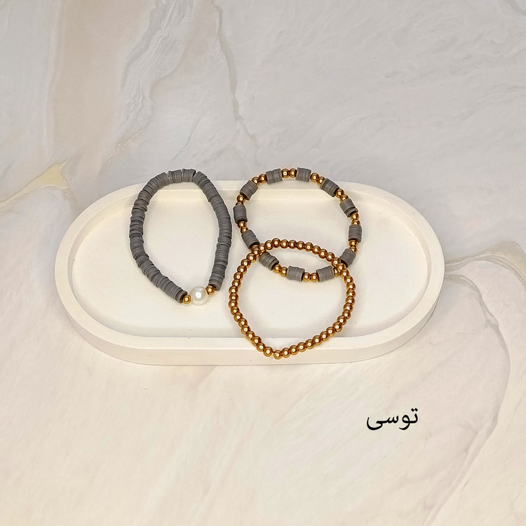 دستبند سه تایی فیمو واشری و مروارید توسی رنگ با مهره های طلایی